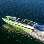 High-performance custom boat in vibrant green and white, cruising on water, showcasing DCB's luxury craftsmanship and engineering.
